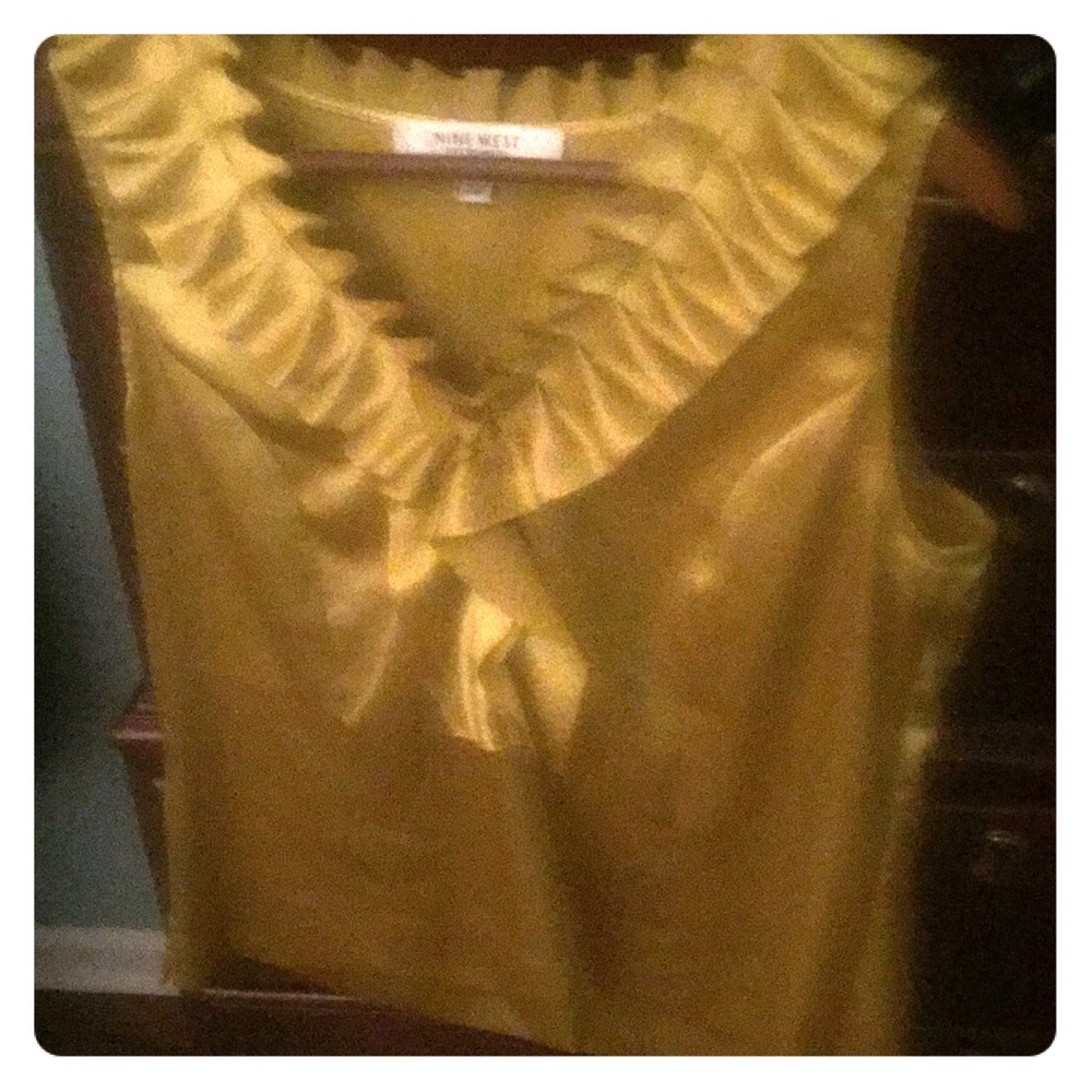 Sleeveless gold shirt
